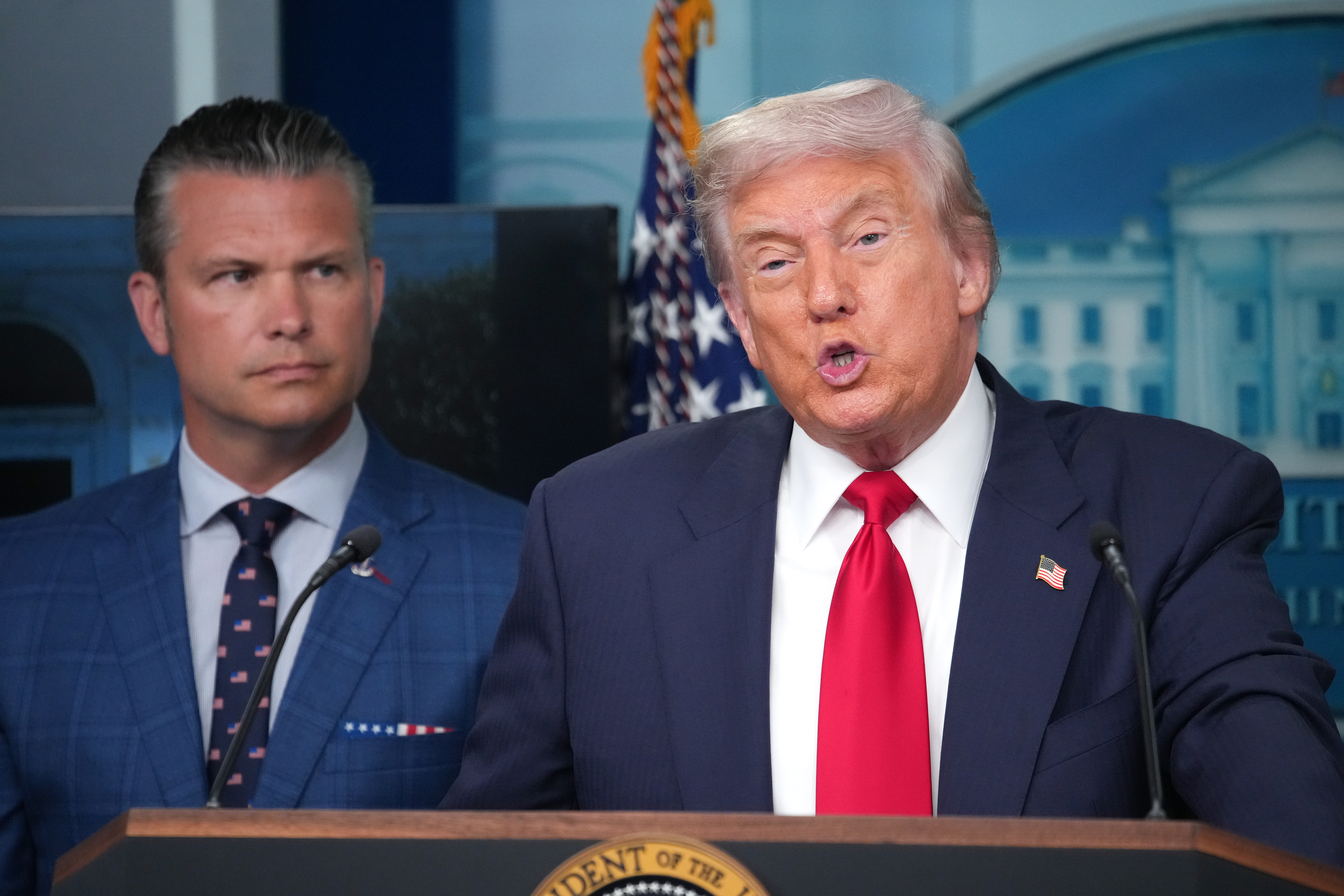 President Donald Trump delivers remarks during a press conference at the White House along with Secretary of Defense Pete Hegseth.